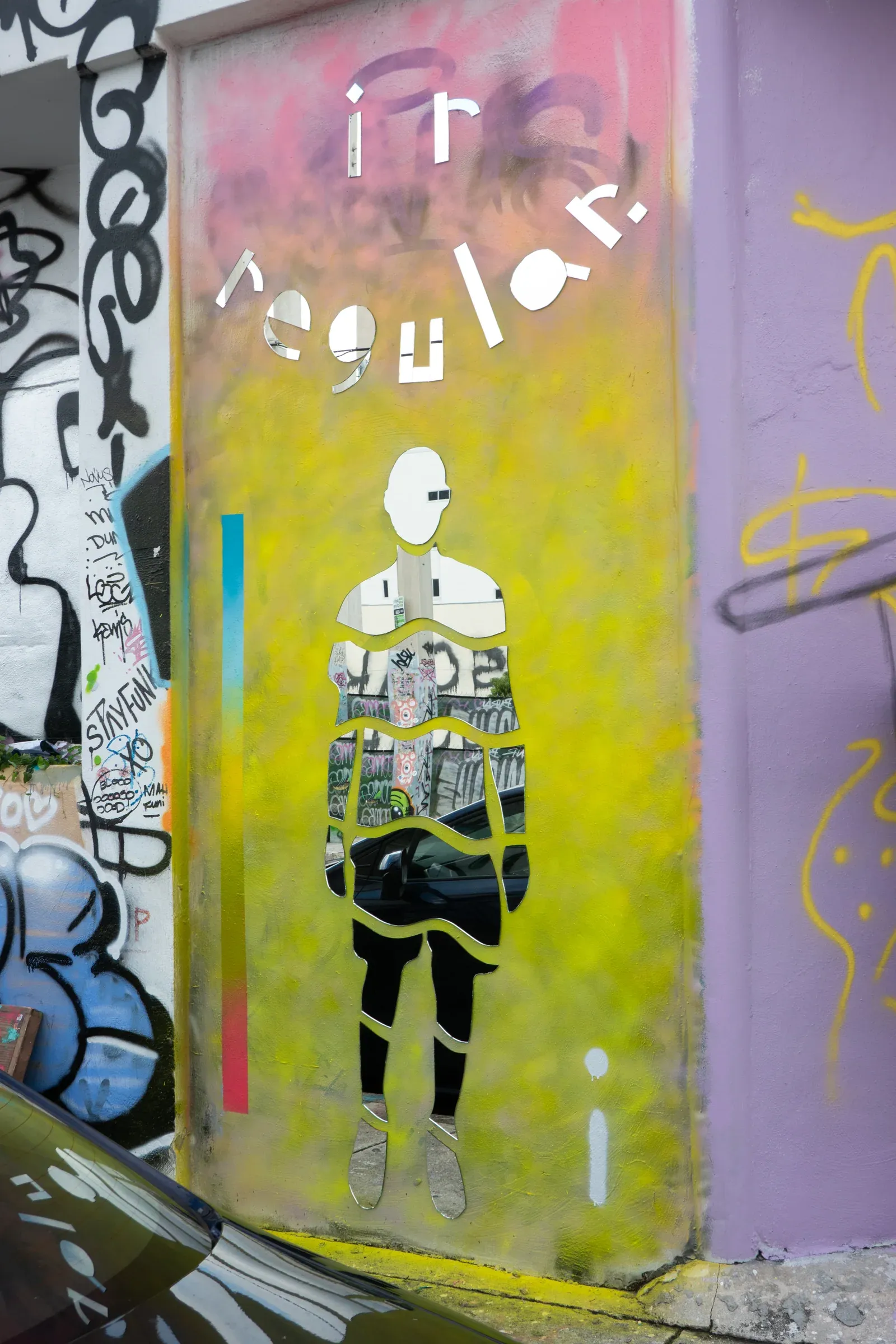 A painted Irregular tag documented on a Miami street.