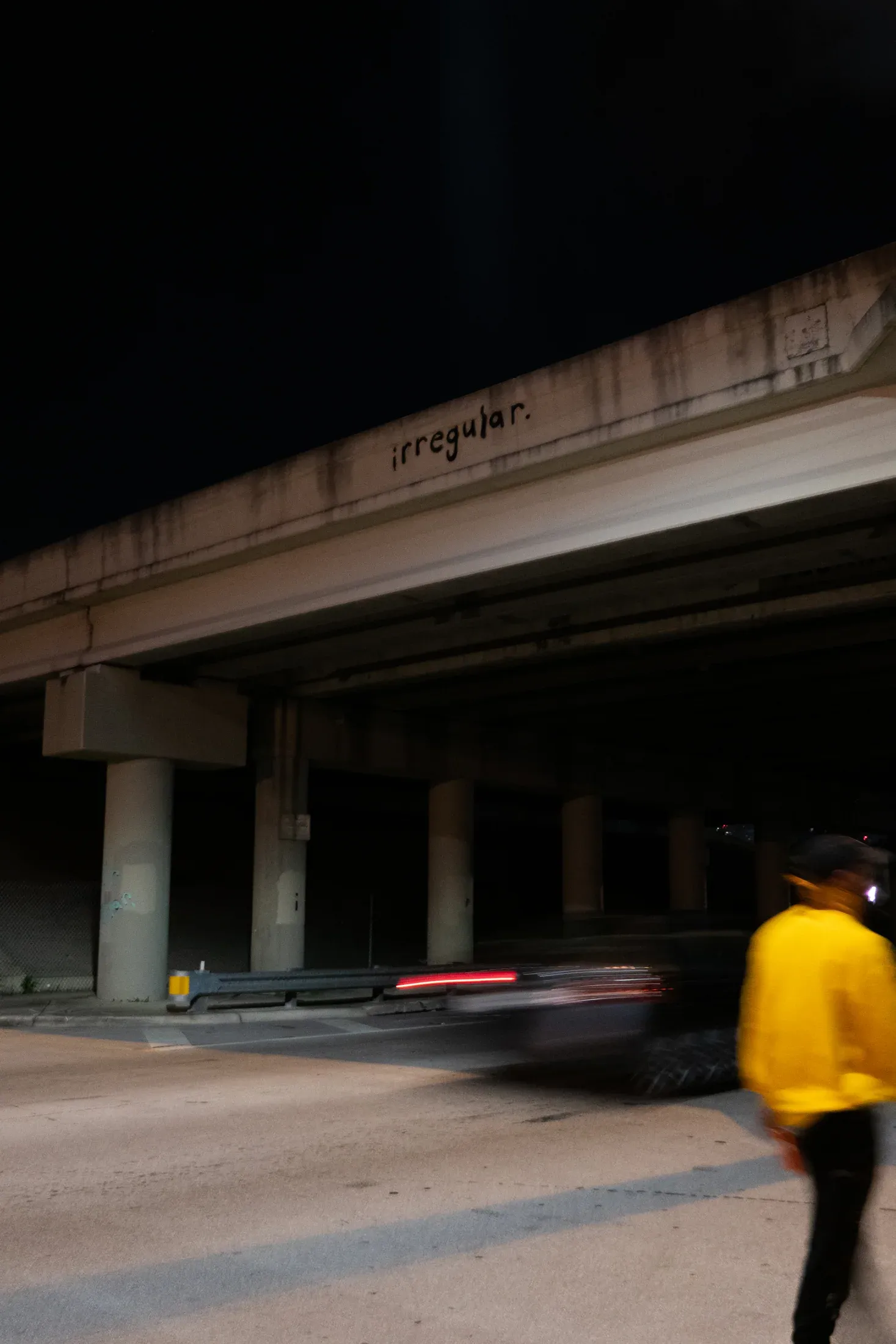 An illuminated underpass encountered while moving through Miami at night.