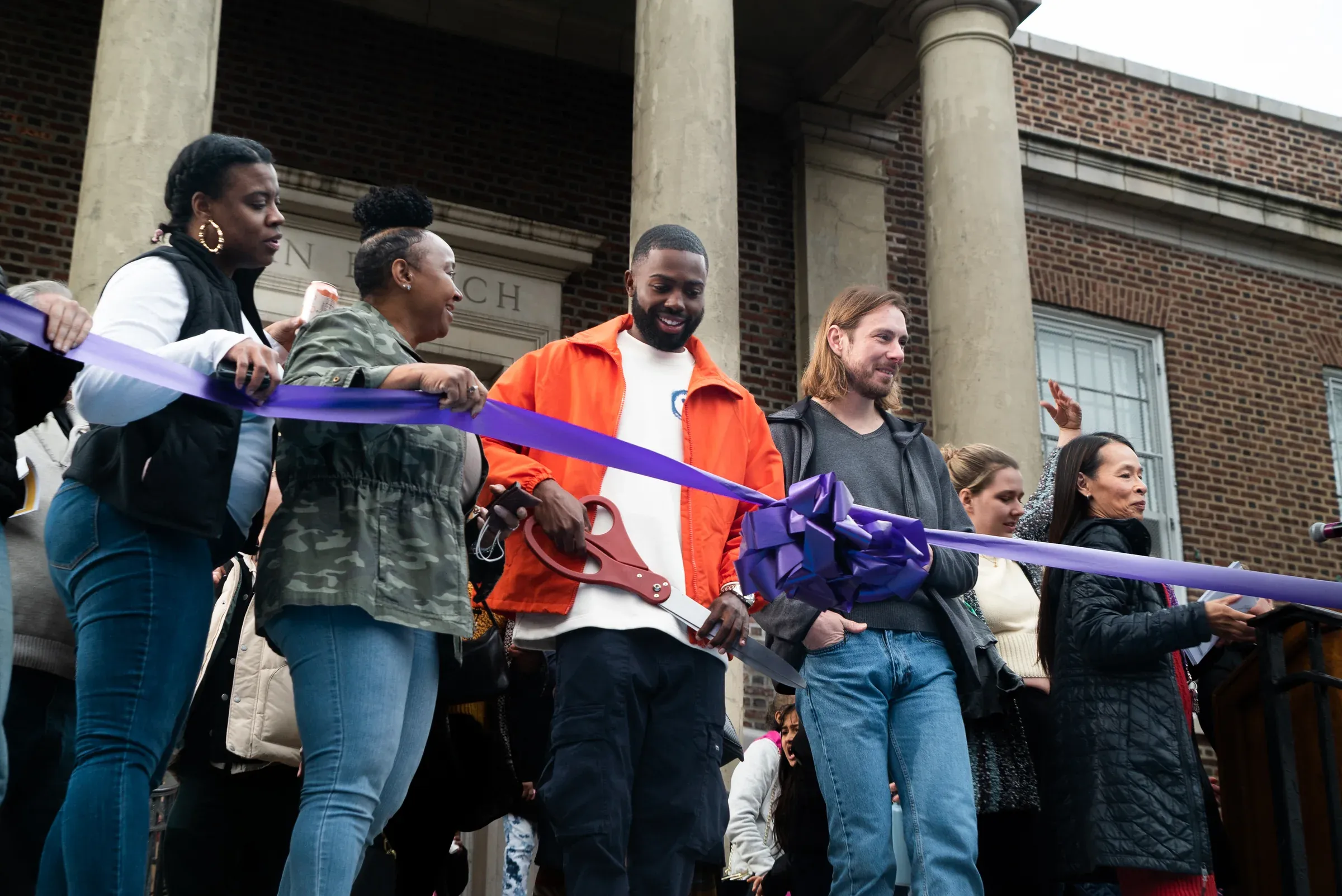 Community members celebrating the opening of a public art project.