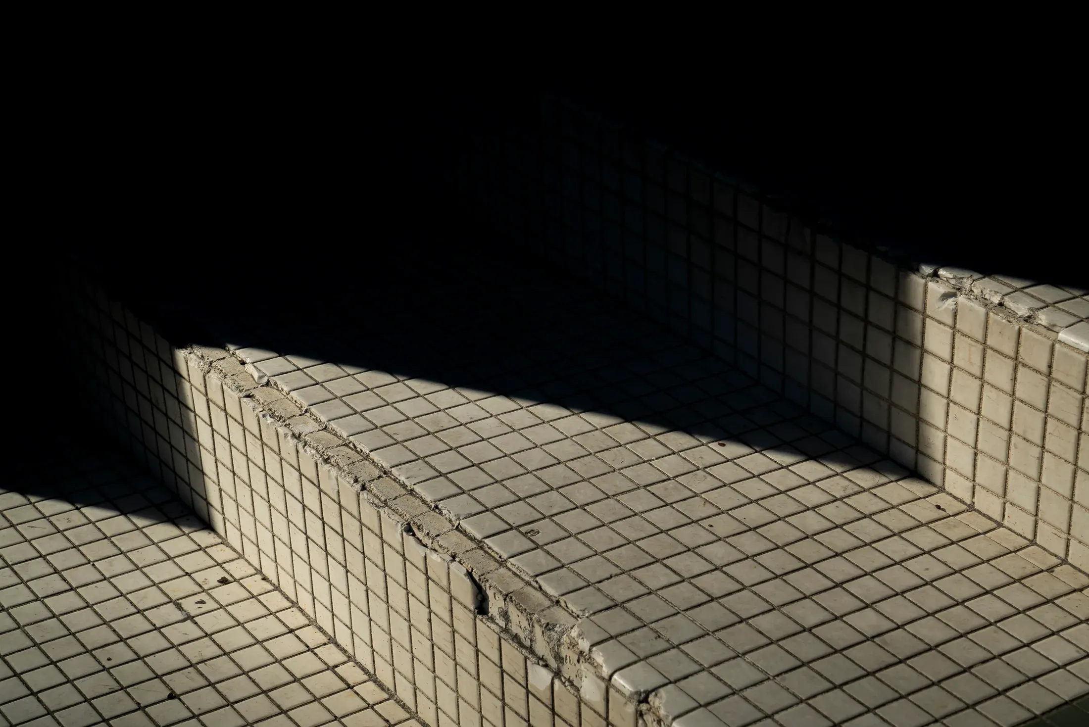 Tiled transit stairs forming a geometric composition.
