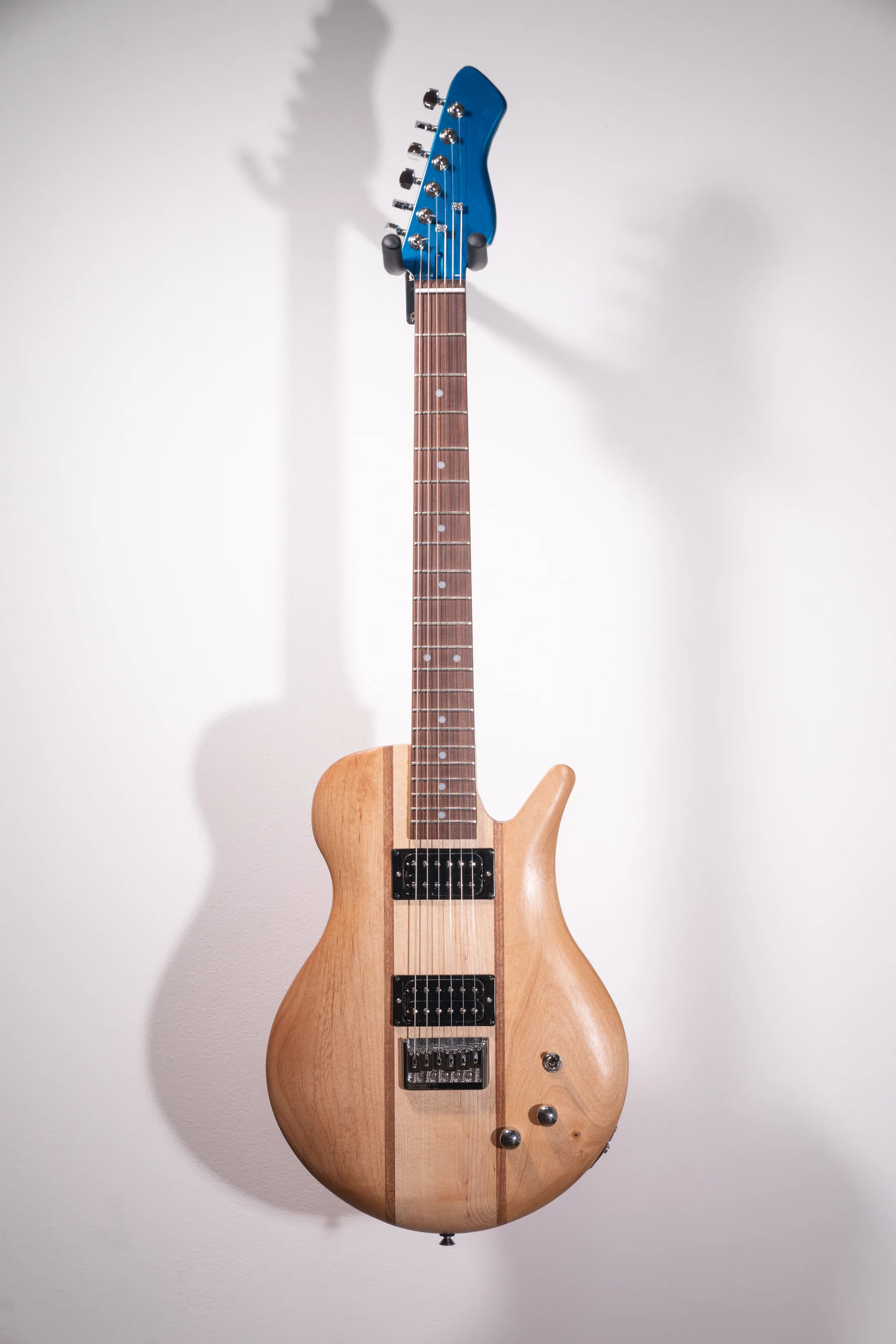 A guitar transformed into artwork for The Art of Guitar exhibition.