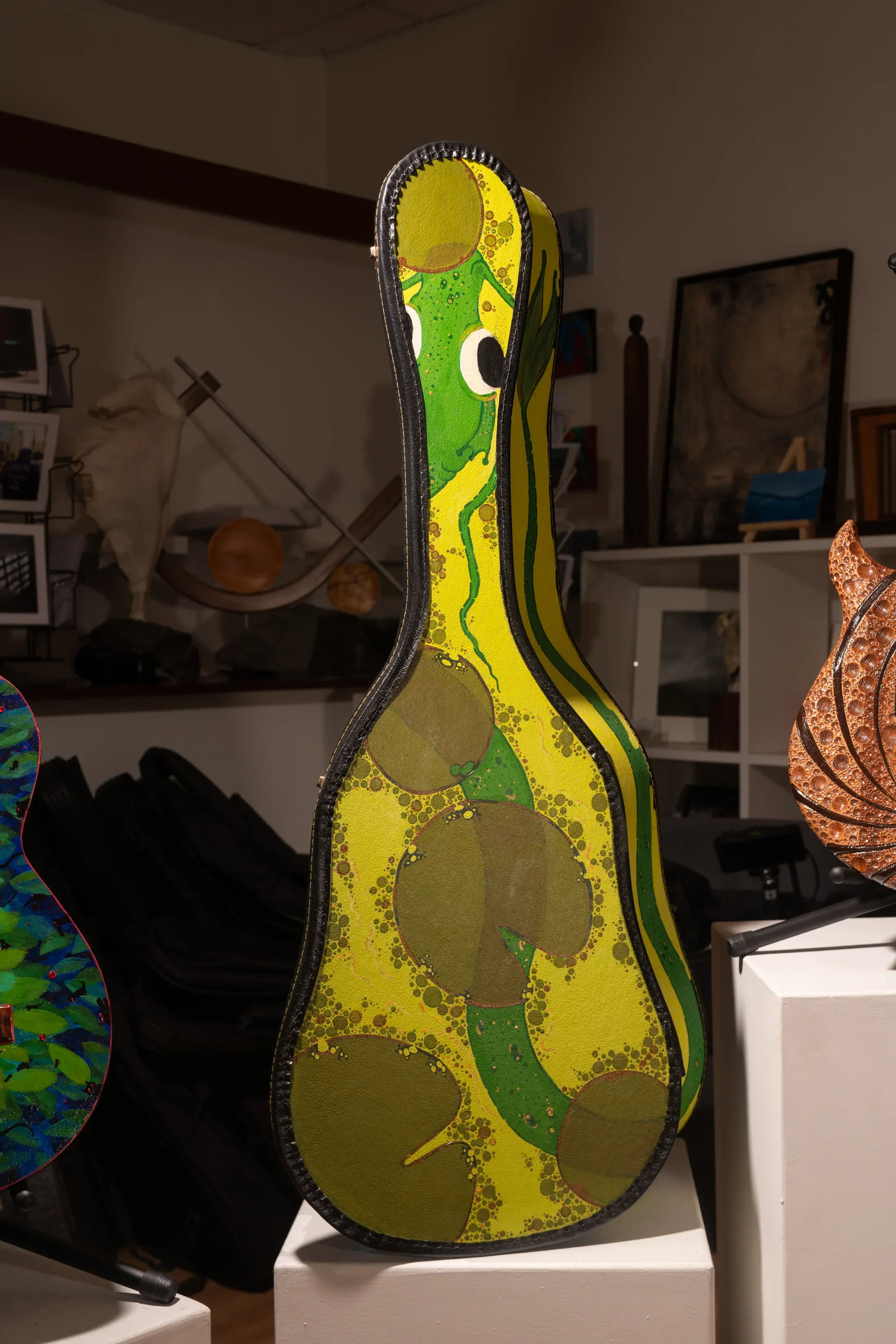 A close view of an artist-made guitar from The Art of Guitar.