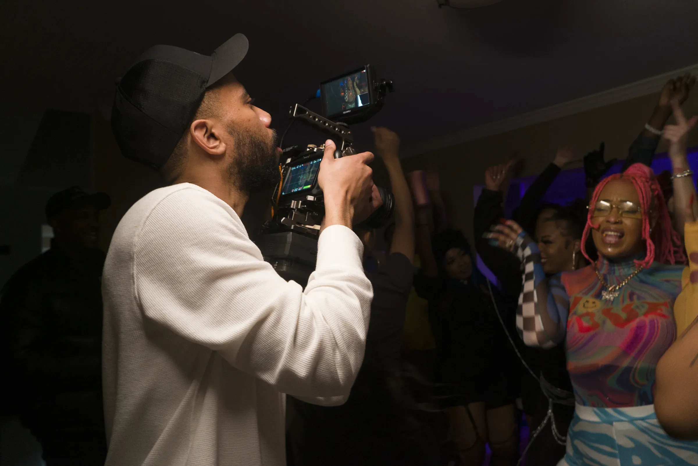 Cinematographer Phil Meyer filming Aquaa Mermaid among the party guests.