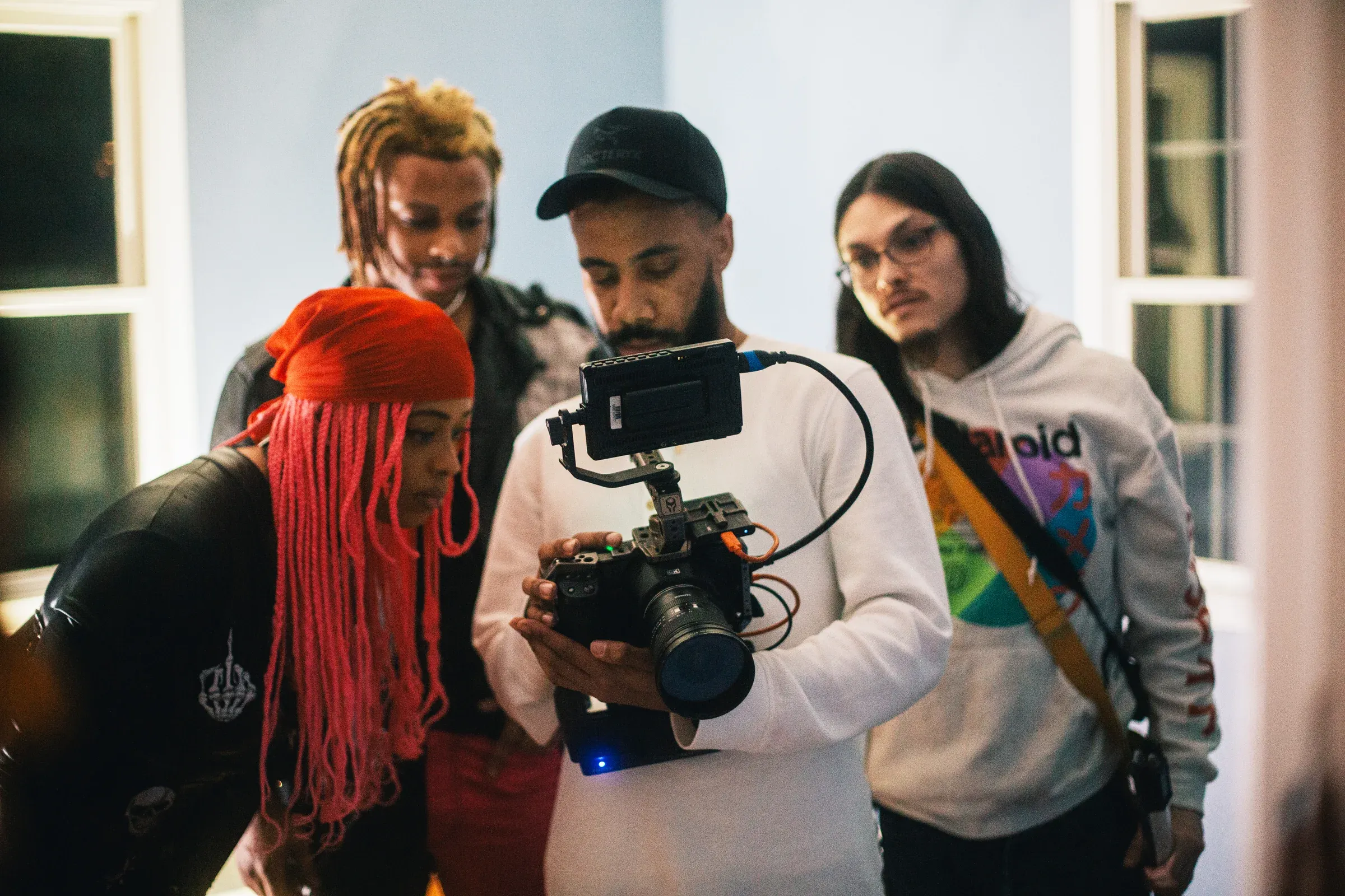 Aquaa Mermaid and the production team reviewing a shot on camera.