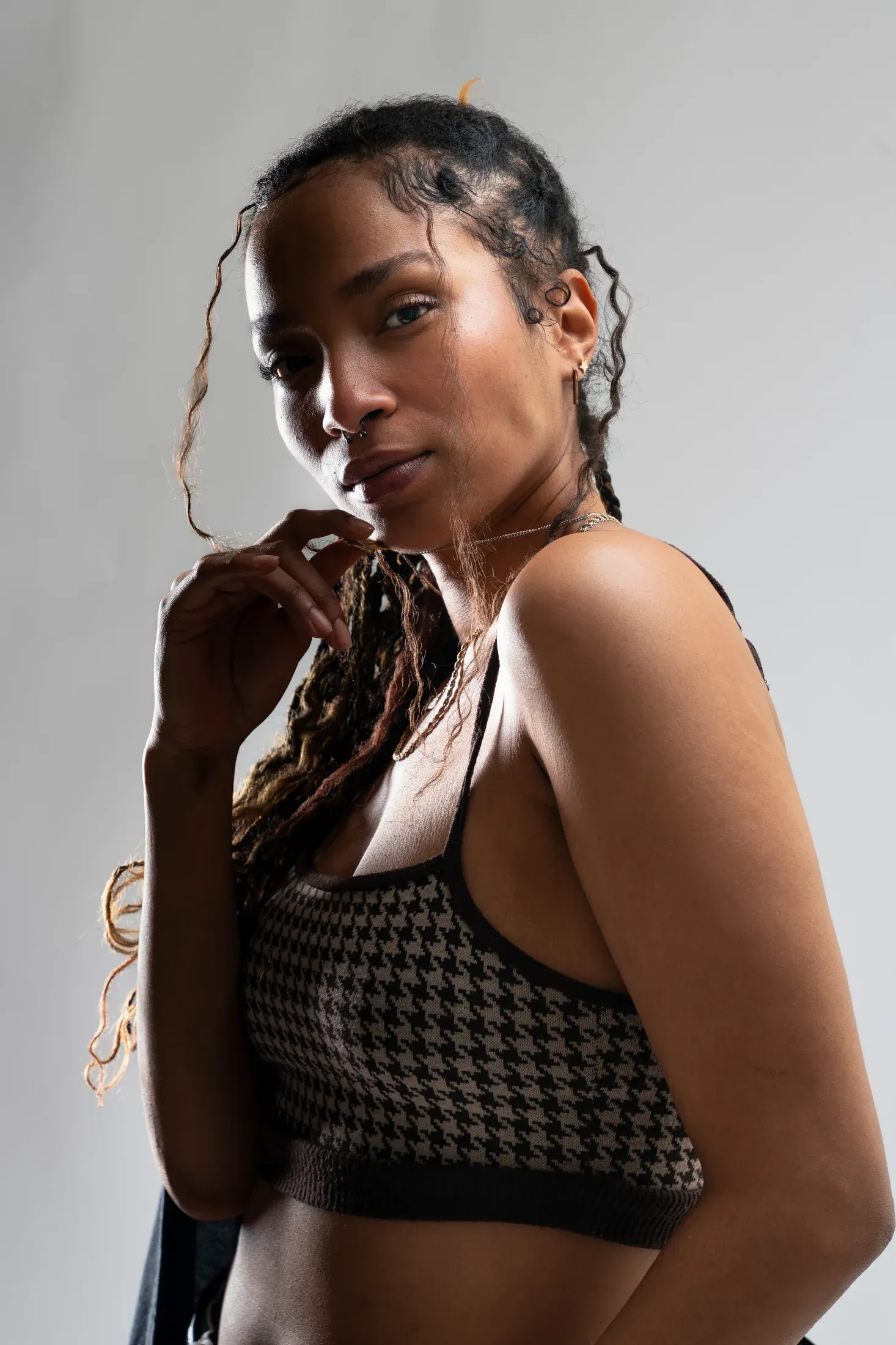 Studio portrait of Ciara against a pale gray background.