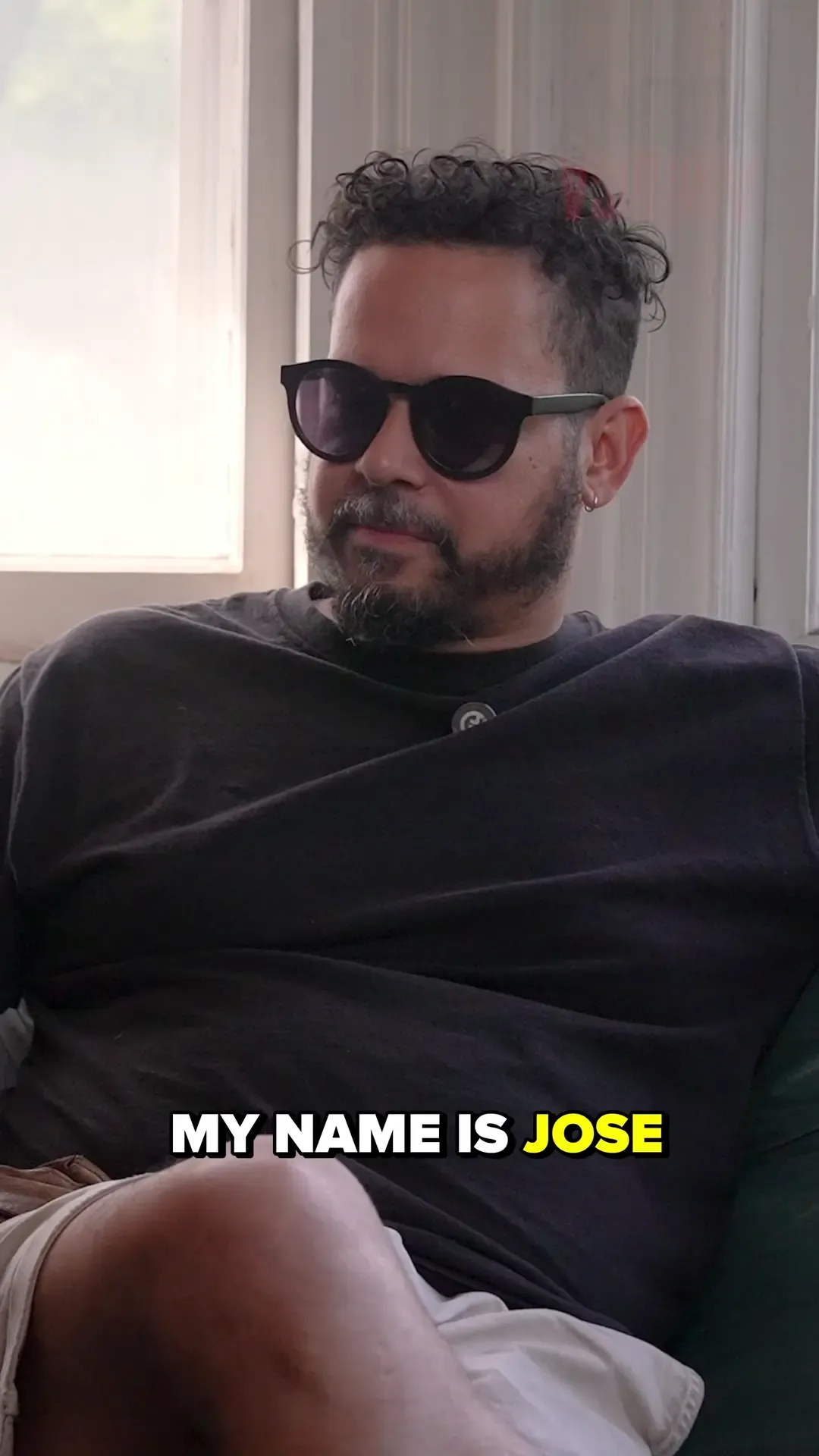 José Ortiz-Pagán seated for an America // América artist interview.